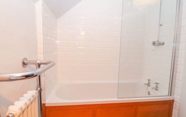 Second bathroom with shower over bath