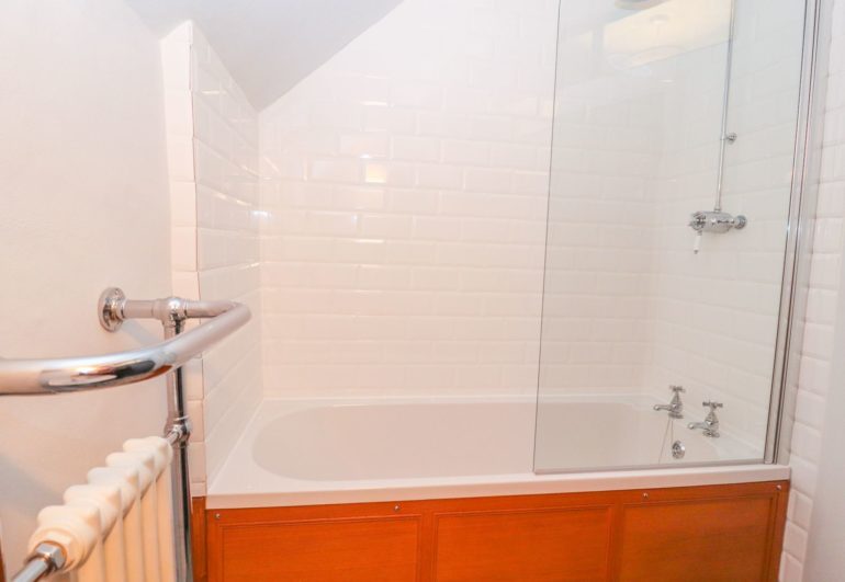 Second bathroom with shower over bath